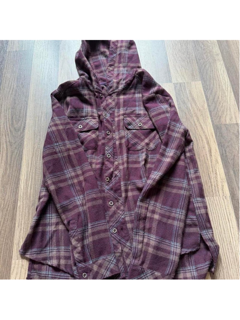Oversized plum purple plaid hooded flannel shacket with a relaxed longline fit